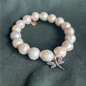 White pearl stretch bracelet with diamond dragonfly charm